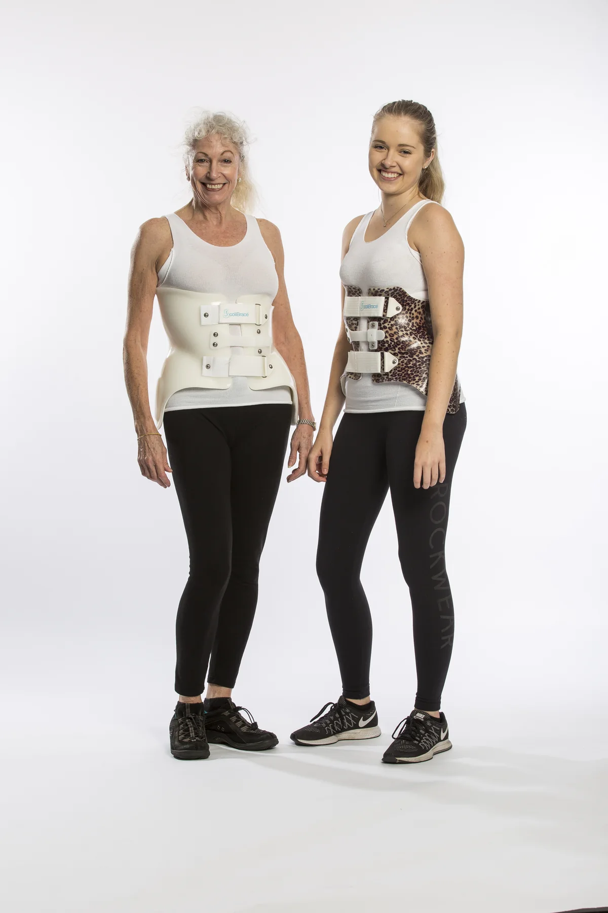 Two patients wearing custom scoliosis braces