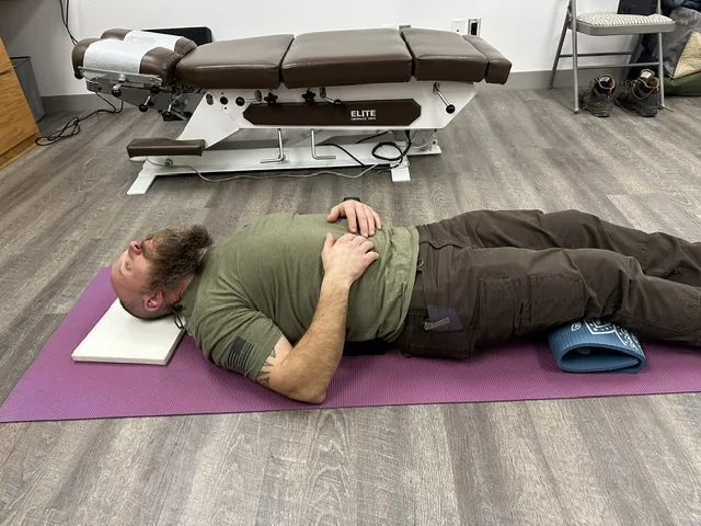 Guided exercise on the mat at Spine and Scoliosis Clinic